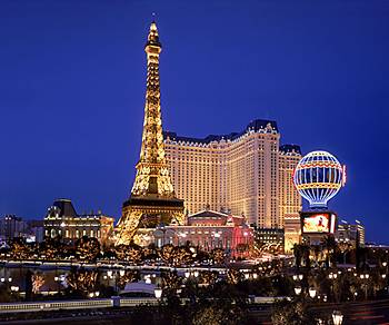 night view of eiffel tower and and montgolfier balloon